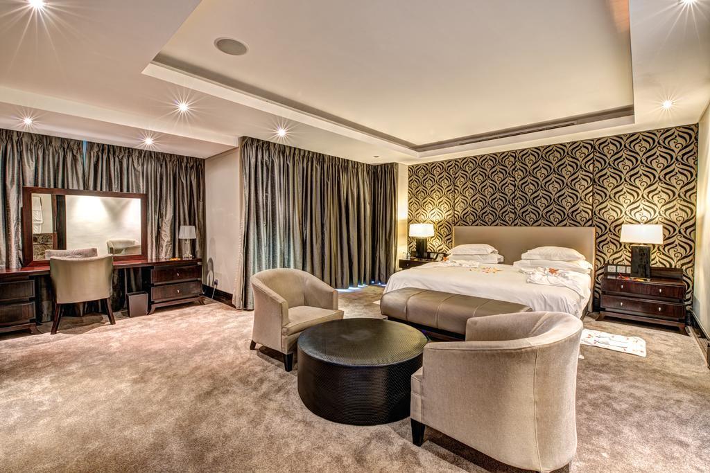Royal Marang Hotel Phokeng Room photo A bedroom at the Taj Mahal Palace